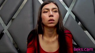 Petite brunette lady in red spreads her legs on cam